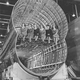 Flight attendants sit on the upper deck of the double-bubble fuselage in this Model 377 under construction. (Author unknown)